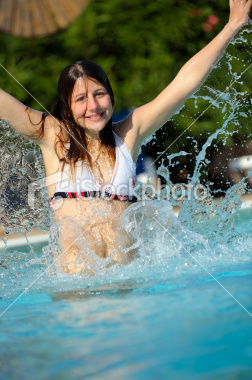 stock-photo-18462131-pretty-girl-splashing-in-the-pool.jpg